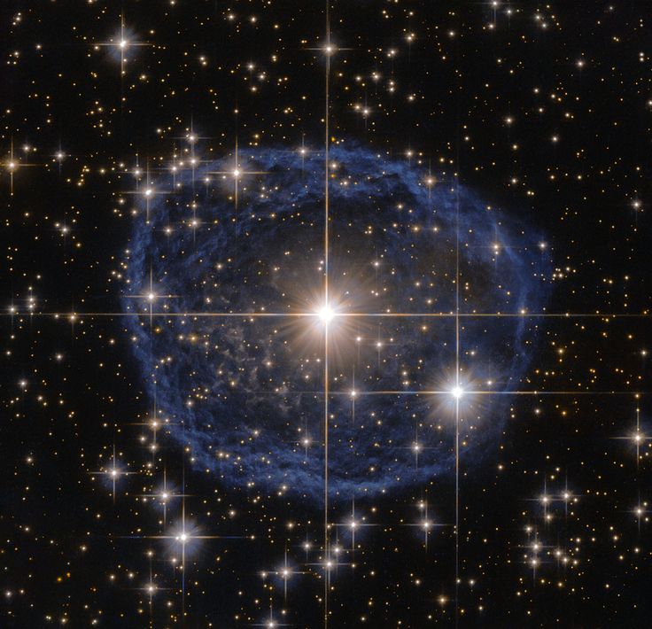 The distinctive blue bubble appearing to encircle WR 31a is a WolfRayet nebula  an interstellar cloud of dust, hydrogen, helium and other gases. Created when speedy stellar winds interact with the outer layers of hydrogen ejected by WolfRayet stars, these nebulae are frequently ring-shaped or spherical.